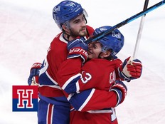 Montreal Canadiens' Cole Caufield (13) hugs Kirby Dach (77) after their win over the Minnesota Wild following third period NHL action in Montreal on Tuesday January 20, 2026.