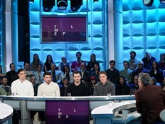 Four men are interviewed in the Tout le monde en parle studio with an audience behind them