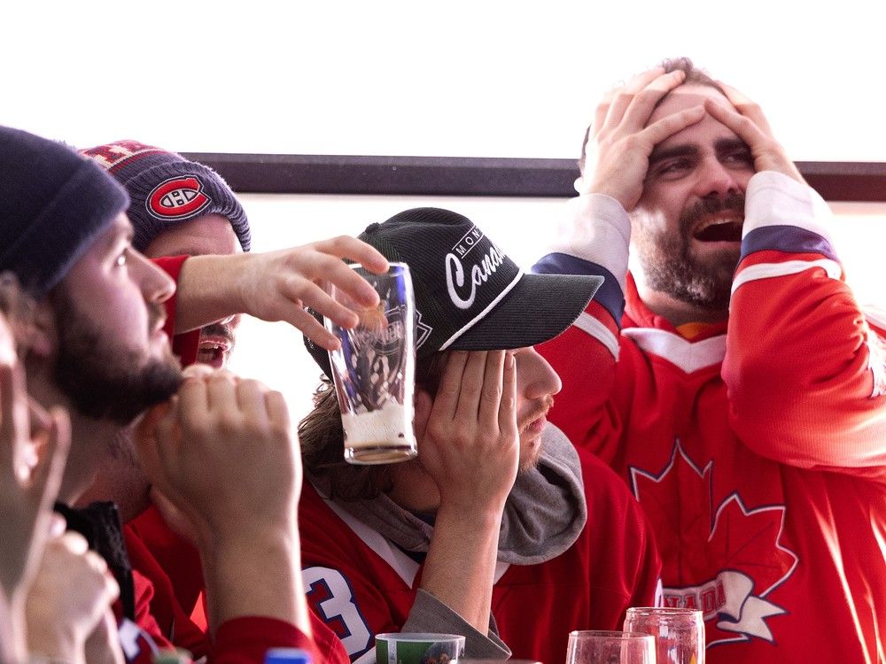 Team Canada fans react as they watch the final minutes of the Olympic men’s hockey gold medal game at Bruno Sport Bar in Montreal on Sunday, February 22, 2026. Team Canada fans react as they watch the final minutes of the Olympic men’s hockey gold medal game at Bruno Sport Bar in Montreal on Sunday, February 22, 2026.