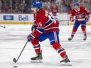 Canadiens' Alex Newhook controls the puck in the New York Islanders' zone during third period in Montreal on Feb. 26.