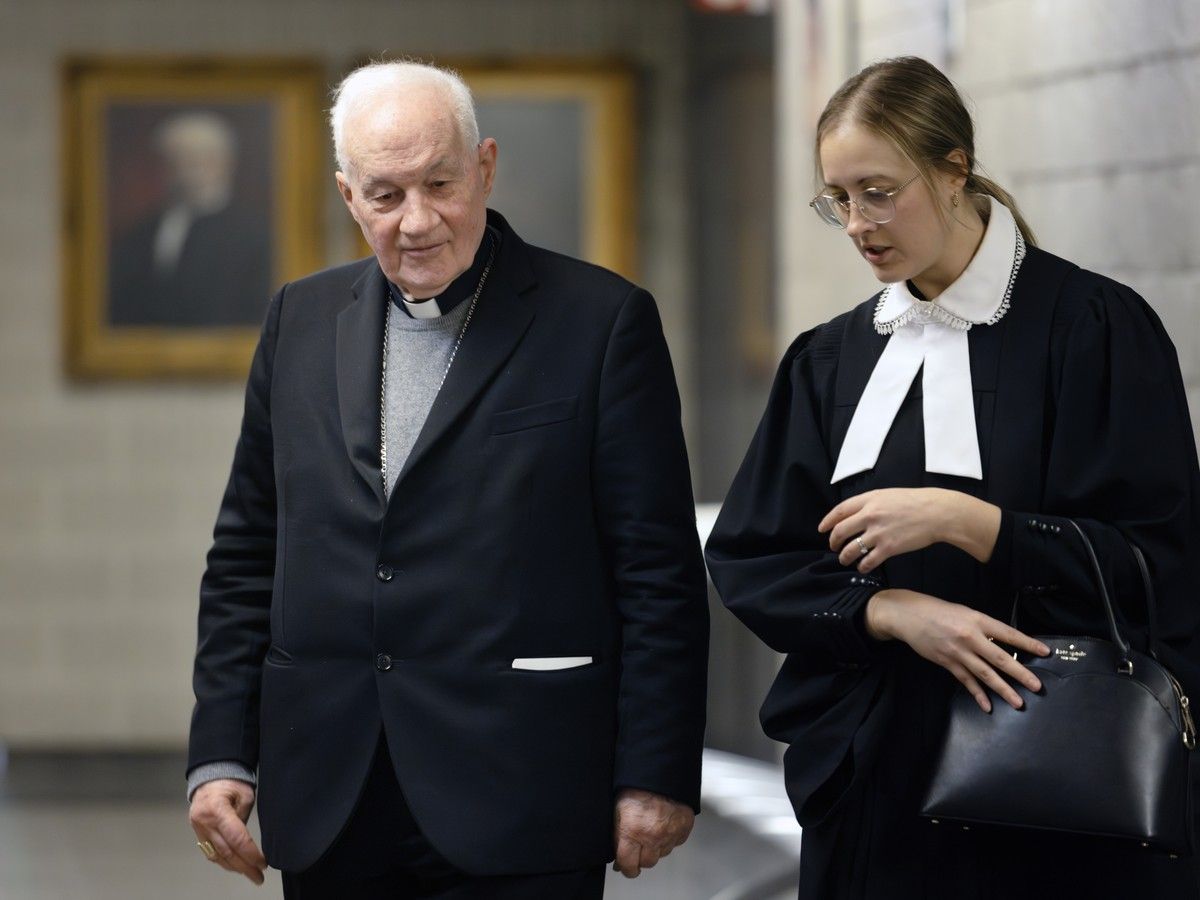  Cardinal Marc Ouellet and a lawyer in his case are seen during a break at the Montreal courthouse on Wednesday, March 4, 2026.