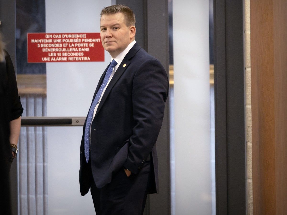  Witness Jérôme Frenette waits outside the courtroom during a break at the Montreal courthouse on Wednesday, March 4, 2026.