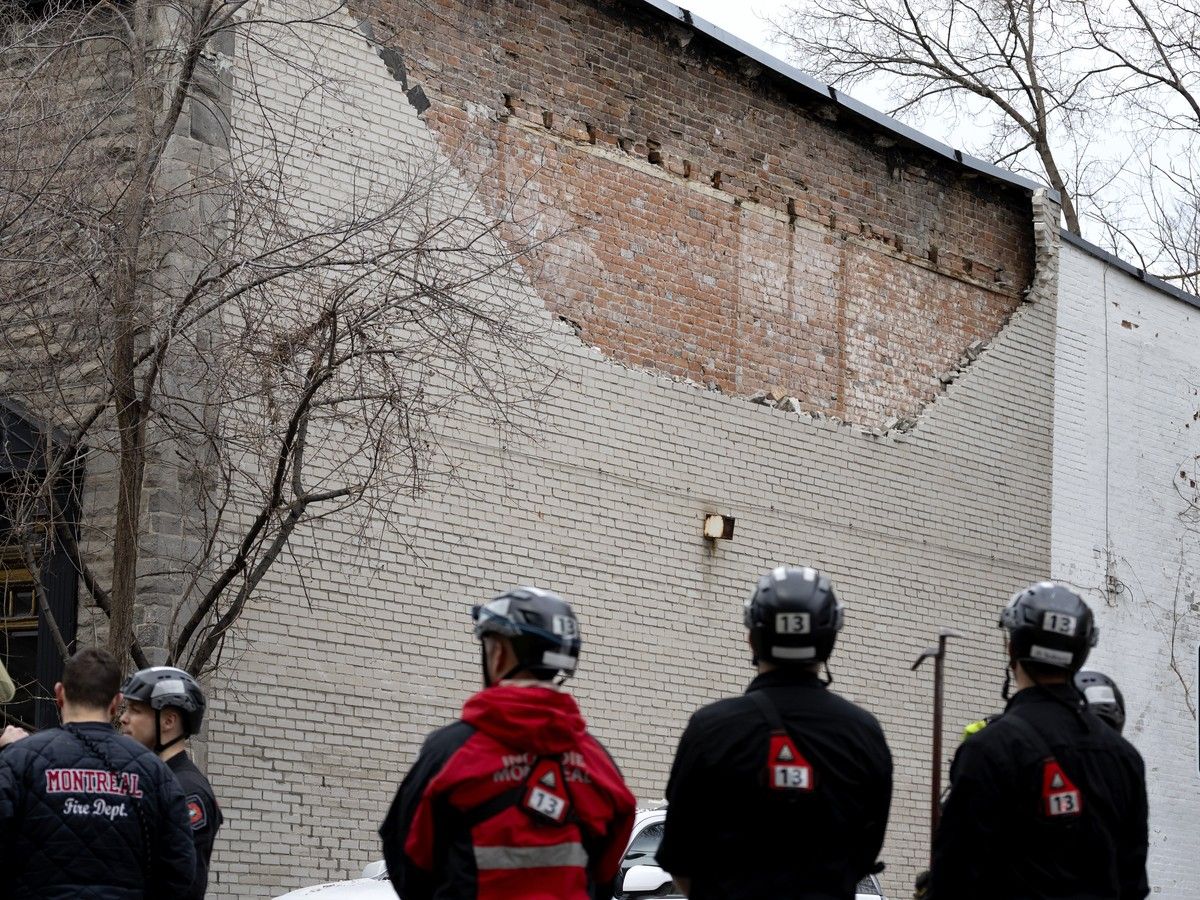  Firefighters and city officials evaluate a building on Victoria Ave. in Westmount after part of a wall collapsed on Tuesday, March 10, 2026.