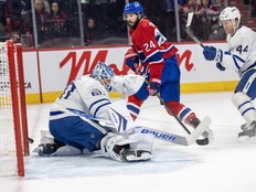 Canadiens' Phillip Danault shoots the puck past Toronto Maple Leafs' Joseph Woll