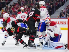 Canadiens forward Jake Evans removes Senators' Fabian Zetterlund from net front as Habs' Noah Dobson and Dylan Cozens scrum in front of goalie Jacob Fowler during second period in Ottawa on Wednesday.