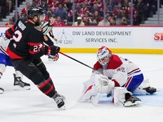 Jacob Fowler of the Montreal Canadiens makes a save against Michael Amadio of the Ottawa Senators in the second period at Canadian Tire Centre on March 11, 2026 in Ottawa.