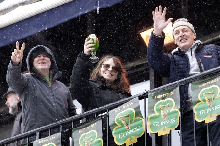 Equipped with green beer, spectators offer cheers from a balcony as they watch the St. Patrick’s Parade in Montreal on Sunday, March 22, 2026. Equipped with green beer, spectators offer cheers from a balcony as they watch the St. Patrick’s Parade in Montreal on Sunday, March 22, 2026.