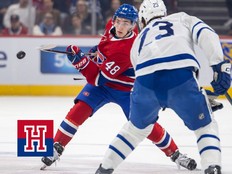 Montreal Canadiens Lane Hutson flips the puck into the offensive zone past Toronto Maple Leafs Matthew Knies during first period of National Hockey League game in Montreal Tuesday March 10, 2026.