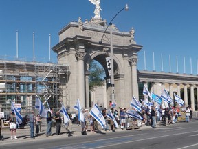 A pro-Israel group shows its support in front of Toronto's CNE entrance.
