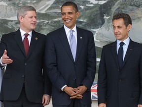 Canadian Prime Minister Stephen Harper, US President Barack Obama and French President Nicolas Sarkozy pose for a family photo last year.