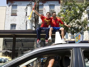 Spain supporters cheer on traffic outside during the World Cup final at Plaza Flamingo on Sunday.