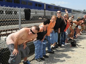 Residents of Laguna Niguel expose their buttocks to a passing Amtrak train during the 31st annual "Mooning of the Trains" event.