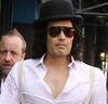 Russell Brand appears de-fuzzed as he films a remake of the 1981 comedy Arthur, in New York City this week.