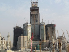The under construction Mecca Clock Royal Tower hotel, topped by the biggest clock in the world with a 45-meter diameter, overlooks the Grand Mosque in the holy Muslim Saudi city of Mecca.