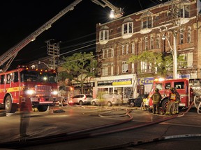 A four-alarm fire broke out on College between Bathurst and Spadina Saturday night just before 11 p.m