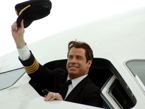 John Travolta waves from the cockpit of the Airbus A380 at Brisbane International Airport.
