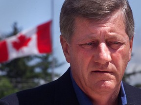 Mike Harris is seen during a press conference in Walkerton in 2000.