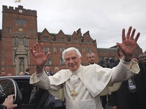 Pope Benedict XVI waves as he leaves Oscott College seminary in Birmingham Sept. 19, 2010.