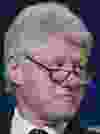 Bill Clinton looks on during a 