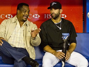 Former Toronto Blue Jay slugger George Bell chats with Jose Bautista, who recently broke Bell's franchise home-run record, at the Rogers Centre on Sept. 28, 2010. Bell set the old mark of 47 in 1987. Bautista leads the majors with 52.