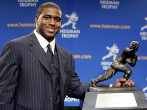 Running back Reggie Bush of the USC Trojans poses with the 2005 Heisman trophy after winning the award at the 71st Annual Heisman Ceremony on December 10, 2005 in New York City.