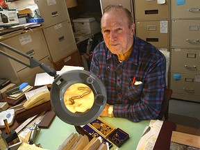 Treasure hunter, Dan Blankenship displays metal chain links, wire and forged metal castings which are just a few of the many relics dating prior to 1750  he's found underground on Oak Island in Nova Scotia