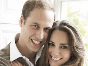 Britain's Prince William and Kate Middleton pose in one of two official engagement portraits.