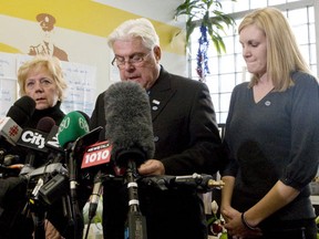 Linda and Glenn Russell, mother and father of Sgt. Ryan Russell and his wife Christine Russell speak during a brief press conference in Toronto on January 21, 2011. Sgt. Russell was killed by a stolen snow plow on January 12.