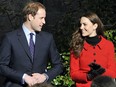 Britain's Prince William (L) and his fiancee Kate Middleton, are pictured during a visit to St Andrews University in Scotland, on February 25, 2011. During the visit they viewed the surviving Papal Bull (the university's founding document), unveiled a plaque and met a selection of the University's current staff and students to mark the start of the Anniversary. Prince William and Kate Middleton attended the university as students from 2001 to 2005 and began their romance in St Andrews.
