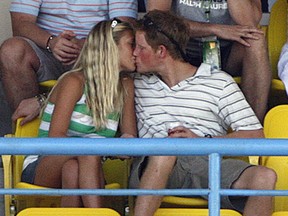 Britain's Prince Harry kisses his on-and-off girlfriend Chelsy Davy.