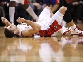 Toronto Raptors Linas Kleiza lays on the floor after missing a shot against the Detroit Pistons, during NBA action at the Air Canada Centre, January 14, 2011 in Toronto.