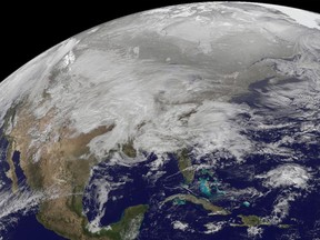This visible image was captured by the GOES-13 satellite and shows the low pressure area bringing snowfall to the Midwest Jan. 31, 2011.