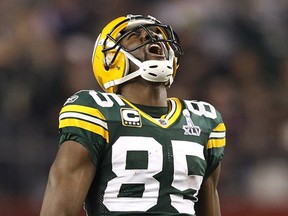 Green Bay Packers Greg Jennings celebrates after catching a pass against the Pittsburgh Steelers in the fourth quarter during the NFL's Super Bowl XLV football game in Arlington, Texas, February 6, 2011.