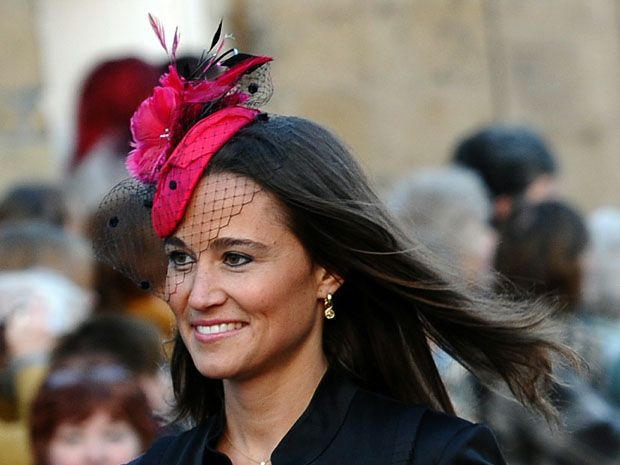 Pippa Middleton, the sister of Kate Middleton, fiancee of Britain's Prince William, arrives for the wedding service of Lady Katie Percy.
