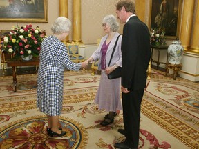 Local Input~ Britain's Queen Elizabeth II (L) receives poet Fleur Adcock (back R) from New Zealand and Poet Laureate Sir Andrew Motion, at Buckingham Palace, in central London, 07 June 2006.