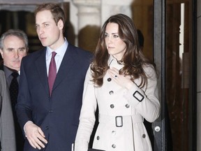 Britain's Prince William and his fiancee, Kate Middleton, leave after their visit to City Hall in Belfast