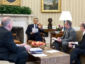 U.S. President Barack Obama (C) receives a briefing on the earthquake in Japan and the tsunami warnings across the Pacific in the Oval Office, March 11, 2011. Briefing the President, from left, are Assistant to the President for Homeland Security John Brennan, National Security Staff Senior Director for Resilience Richard Reed, and National Security Staff Director Asian Affairs Daniel Russel.