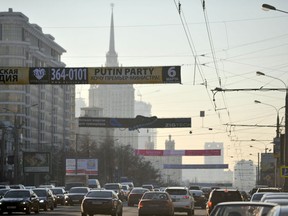 An sign advertising a dance night called Putin Party with the slogan reading in Russian "I want a prime minister" is pictured above one of the main street in Moscow on March 1, 2011. A glitzy Moscow night club sparked controversy on March 1, 2011 by advertising a dance night called Putin Party, with a flyer praising the strongman prime minister as an "object of desire." The party's theme was chosen by a poll of female clubbers, who were asked to vote for the most attractive man from a list including footballer David Beckham and actor Bruce Willis.