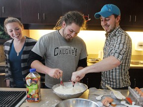 Instructor Dan Clapson (R) with two students at a 'Kick the KD' class.