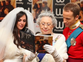 Kate Middleton (L), Britain's Queen Elizabeth II (C) and Prince William lookalikes pose for photographs in central London.