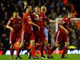 Liverpool's Dutch forward Dirk Kuyt (3rd L) celebrates after scoring the second goal during the English Premier League football match between Liverpool and Manchester City, at the Anfield stadium in Liverpool, on April 11, 2011.