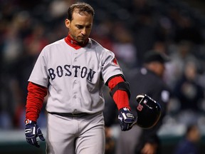 Marco Scutaro of the Boston Red Sox throws his helmet down after striking out looking against the Cleveland Indians on April 6, 2011. The Red Sox lost 8-4.