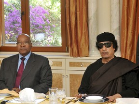 Hello, I am Muammar Gaddafi. I am very pleased to be here. No, really. Who is this man on my right? May I have some eggs please?