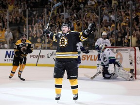 Brad Marchand of the Boston Bruins wears a Hockey Fights Cancer warm  News Photo - Getty Images