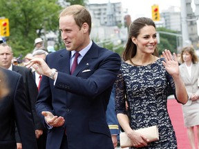 Britain's Prince William and his wife Catherine, Duchess of Cambridge, arrive at the National War Memorial in Ottawa June 30, 2011. The Royal couple arrived in Canada on Thursday for their first official visit overseas as a married couple. REUTERS/Blair Gable     (CANADA - Tags: ENTERTAINMENT POLITICS ROYALS)