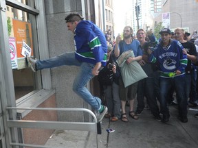 Vancouver fans riot after the Canucks loss to the Boston Bruins in NHL Stanley Cup final in Vancouver , B.C. June 15, 2011