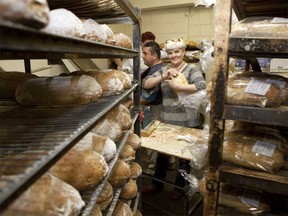 Aniela Klimaslewska packages bread at Raw Design's party at the Ontario Bread Company on Ossington. The architecture company had cutting-edge technology onsite that allowed party-goers to create their own fantasy townhouses; renderings of the homes are below.