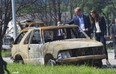 Britain's Prince William and his wife Catherine, the Duchess of Cambridge look at the damage left after a forest fire in Slave Lake, Alberta July 6, 2011. The Royal couple made a side trip to visit the community that was 30 percent destroyed by the fire earlier this year. The Prince and his wife Catherine are on a royal tour of Canada from June 30 to July 8. REUTERS/Andy Clark    (CANADA - Tags: ROYALS SOCIETY ENTERTAINMENT POLITICS)