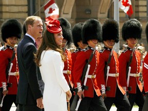 Prince William and his wife, Catherine, the Duchess of Cambridge, arrive on Parliament Hill on Ottawa during Canada Day celebrations on the second day of their nine-day tour of Canada on July 1, 2011.     AFP PHOTO / TIMOTHY A. CLARY (Photo credit should read TIMOTHY A. CLARY/AFP/Getty Images)