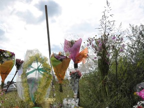 Flowers and a placard calling to stop ANC youth leader Julius Malema and to stop the murders are pictured outside the farm of late South African white supremist Euguene Terre'Blanche  in Ventersdorp on April 5, 2010 where will be beared on Friday. White supremist Eugene Terre'Blanche was killed on Saturday in an attack that his far-right Afrikaner Resistance Movement (AWB) has blamed on the singing of a slogan "kill the boer", Afrikaans for farmer. AFP PHOTO / ALEXANDER JOE (Photo credit should read ALEXANDER JOE/AFP/Getty Images)